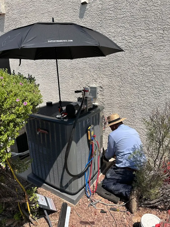 HVAC technician performing outdoor AC maintenance in San Ramon